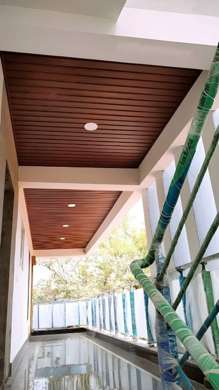 Modern Slatted Wooden Ceiling with LED Integration